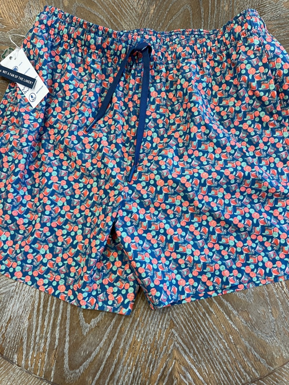 Southern Tide Navy Swim Trunks with Coral and Teal Fruit Print